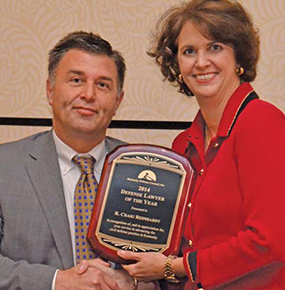 Photo of attorney Katherine J. Hornback, receiving the 2014 Defense lawyer of the year award